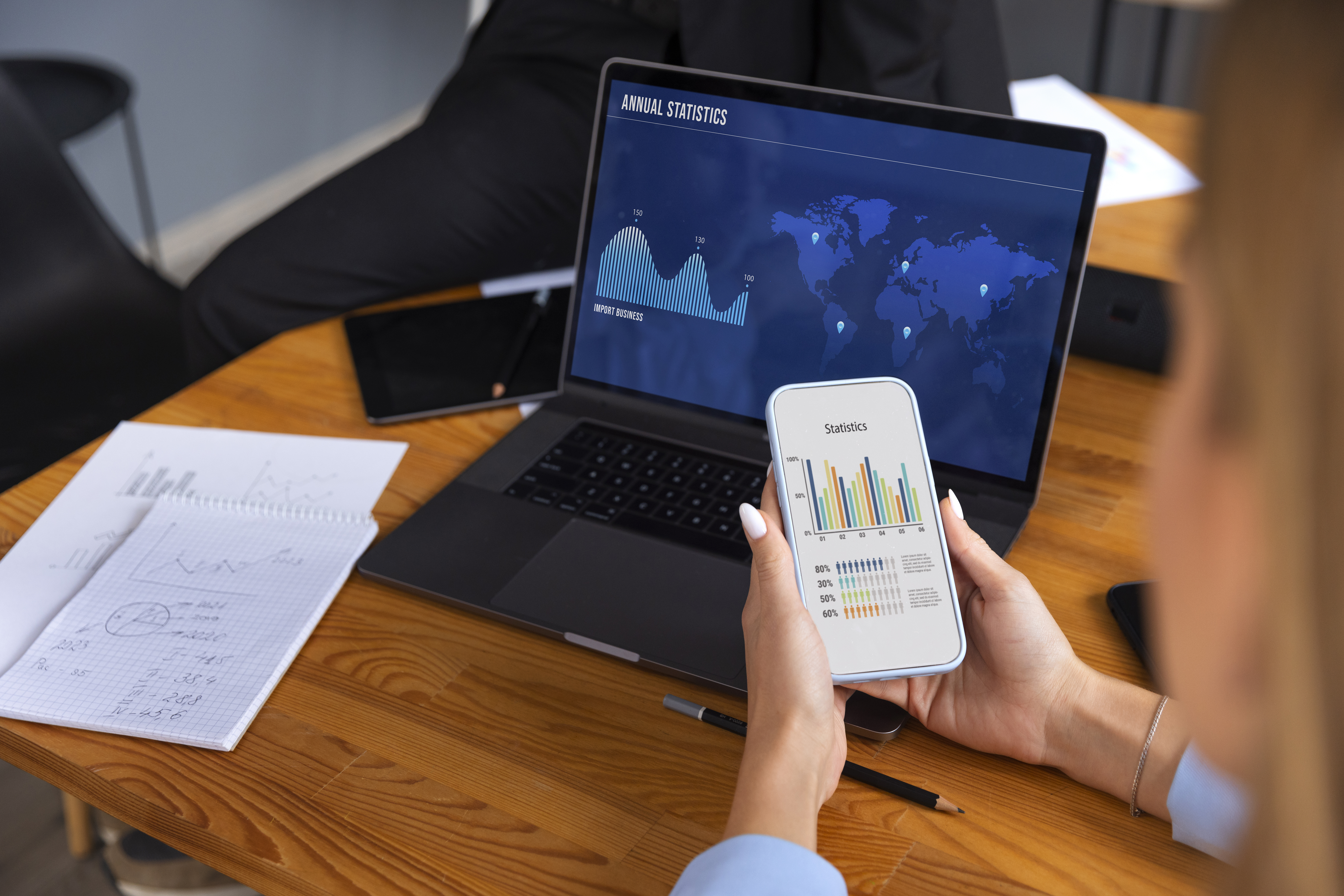 A plant manager reviews data on a plant blueprint